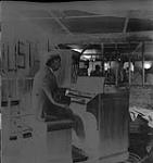 Man Playing Organ [ca1954-1963]
