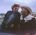 Cliff Claggett and Bert Downes at the round-up events, Swan River, Manitoba June 30, 1956.