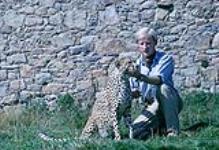 Jeremy Mallinson with a cheetah. Channel Island Zoo. Jersey [ca. 1953-1964]
