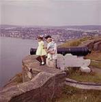 Man and children at lookout point with cannon, St. John's Newfoundland August 1960
