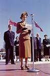 Princess Elizabeth and the Duke of Edinburgh. Princess Elizabeth is speaking into a microphone and holding some papers. Royal Visit 1951, Ontario. [Between October 8th and November 10th 1951].