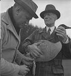 Jack Miner, Cdn. Geese, Jack Miner and an unidentified man and a Canadian Goose [between 1939-1951].