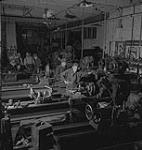 Saskatoon & Wheat, men working in a factory [between 1939-1951].