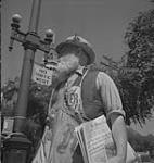 Winnipeg, 1940's. Unidentified Man With Beard Selling the Winnipeg Tribute [between 1940-1949]