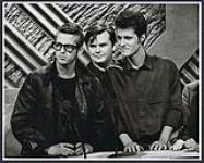 Three members of Blue Rodeo on stage accepting an award [entre 1989-1992].