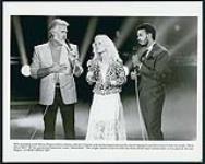 RCA recording artist Kenny Rogers (left) is shown with Kim Carnes and James Ingram during the recent taping of a performance of their hit single "What About Me?" for the syndicated television show "Solid Gold." [ca. 1984]