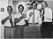 Pictured at the time of signing the MuchMusic / Rogers Cablesystems agreement (L to R): Alan Waters (President, CHUM-FM), Moses Znaimer, President and Executive Producer CITY TV and the MuchMusic network), Colin Watson (President, Rogers Cablesystems), and Ted Rogers (Vice Chairman and Chief Executive Officer, Rogers Cablesystems) [entre 1990-2000]