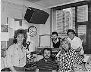 L to R: John Sievert (from the band Select Few), FM 96 drive personality Dan Walker, Music Director Greg Simpson, Jaclyn Sole (from the band Select Few), and FM 96 Program Director Barry Smith [entre 1980-1990]