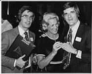 L to R: CHUM's JR Wood, Carol Wood, and CHUM's Ontario Sales Manager B. Stafford [between 1975-1985]