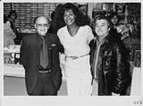 Claudja Barry at Sam's Yonge Street store in Toronto with Morrin Singer and an unidentified man [between 1985-1995]