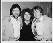 After winning a sixth consecutive Juno award as Canada's Best Country Group, the Good Brothers' Brian Good celebrates with label mate Brian MacLeod of Chilliwack (centre) and Solid Gold Records' Neill Dixon (right) ca. 1982.