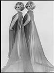 Portrait of two women wearing long transparent dresses [entre 1965-1970].