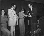 Three members of the Family Brown receiving an RPM Big Country Award [ca 1975].