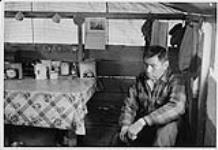 Aboriginal man seated in old mission hospital, Fort Simpson, Northwest Territories 1975