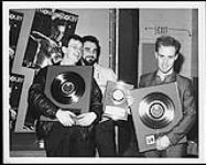 Thomas Dolby receives awards for the LP 'The Flat Earth', The Single "She blinded me with Science" and the mini- album "Blinded by Science" [ca. 1984].