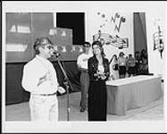 SOCAN Board member Eddie Schwartz presenting four SOCAN No.1 plaques to Shania Twain in recognition of her songs "Any Man of Mine," "The Woman In Me," "I'm Outta Here," and "No One Needs to Know" - awards presented August 17, 1996 at Fan Appreciation Day, Canadian National Exhibition, Toronto 17 août 1996