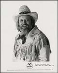 Press portrait of Ronnie Hawkins wearing a cowboy hat and fringed jacket [entre 1980-1985].