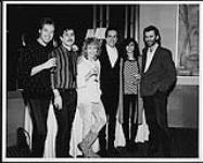 Iggy Pop receiving his first gold record award for the album "Blah Blah Blah," prior to his performance with the Pretenders in Vancouver, March 19. A&M Canada staff (l to r): David Brian, Tom Jones, Julianna Raeburn, (Iggy Pop), Eva Toth, Jim Monaco [ca. 1987].