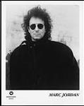 Press portrait of Marc Jordan wearing sunglasses [entre 1977-1979].