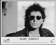 Press portrait of Marc Jordan wearing sunglasses [entre 1996-1997].