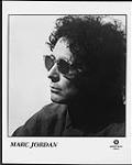 Press portrait of Marc Jordan wearing sunglasses [between 1977-1980].