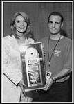 Epic Recording Artist Patty Loveless receiving her CRIA (Canadian Recording Industry Association) certified Gold Record in Moncton, NB for her latest release "Long Stretch of Lonesome." [entre 1997-1999]