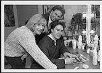 Joyce Resin and Paddy Moore from the CBC 'Alive Show' with Tylie Ross, as he signs autographs [entre 1992-1999].