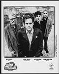 Portrait de presse de The New Meanies. De gauche à droite : Sky Onosson (basse), Damon Mitchell (voix/guitare), Jeff Hondubura (guitare) et Jason Omand Kane (batterie). Virgin Music Canada juillet 1997