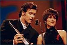 Roch Voisine and Michelle Wright accepting an award at the Juno ceremony 1992.