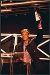 An unidentified man accepting a Juno Award  [entre 1970-2000].