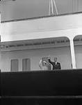 Queen with Prince Philip waving on royal yacht 26 June 1959.