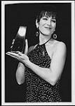 Michelle Wright holding an unidentified award [between 1990-1993].