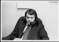 Unidentified man using a telephone [entre 1969-1979].