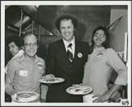 The owner of Smitty's and the staff of CKXL serve pancakes in aid of the CKXL Children's Fund [entre 1970-1975].