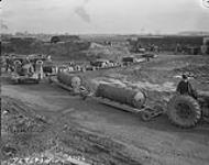 [Tractor hauling high explosive to the heavy bombers of RCAF Bomber Group Overseas] [1944].