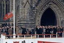 Raising of the maple leaf flag of Canada for the first time, at 12 noon, in front of the Peace Tower 15 February 1965.