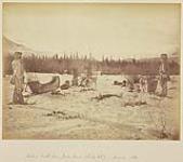 [View of three men and two teams of dogs hitched to carioles looking towards the Rocky Mountains at Jasper House, Alberta]. Original title: Looking South from Jasper House (Rocky Mts). January 1872.