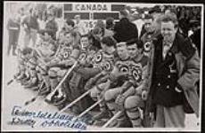 The RCAF Flyers hockey team on the players' bench during a game against the Swiss national men's hockey team at the 1948 Winter Olympic Games in St. Moritz, Switzerland 8 February 1948.