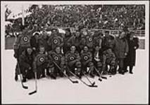 Members of the RCAF Flyers, winners of the ice hockey gold medal, on the winners podium at the 1948 Winter Olympic Games in St. Moritz, Switzerland 8 Févier 1948.