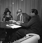 Variety Newspaper Visit - P. [Philippe] de Gaspé Beaubien with New York Couple [between 1964-1967]