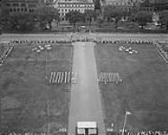 Sunset Ceremony. Shot from Peace Tower over-looking the formations on the front lawn of Parliament Hill 1 July 1959.