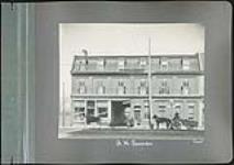 Commercial Building owned by R.H. Pounder, [containing Almonte House Hotel, 223 - 225 Wellington Street and New Almonte Lunch 229 Wellinton Street] ca. 1912