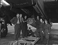 Bomb ground crew members with bomber crew 86 26 August 1944.