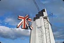 Raising three-dimensional Union Jack flag for top of Great Britain Pavilion November, 1966