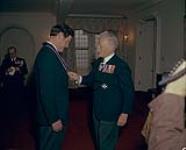 Edmond Butler being invested as Commander of the Royal Victorian Order by Governor General Roland Michener 1972.