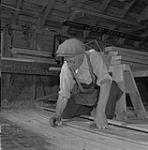 Alton L. McKay working on a ship 1950