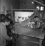 Filming puppets for the National Film Board animation film "Sing a Little" Dec. 1950