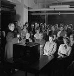 Deaf people lip reading a television program 1952