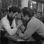 Two young men arm wrestling 1955