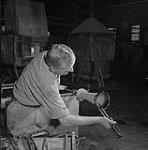 John Furch adjusting a glass vase 1955